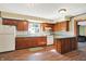 Kitchen with wood cabinets, laminate counters, and hardwood floors at 9490 N 700 E, Indianapolis, IN 46259