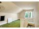 Unfinished attic bedroom with green carpet and two windows at 9490 N 700 E, Indianapolis, IN 46259
