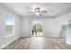 Bright dining room with sliding glass doors leading to a patio at 10604 Pavilion Dr, Indianapolis, IN 46259
