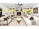 Sunroom with cozy seating, a fireplace, and plenty of natural light at 11730 Ansley Ct, Zionsville, IN 46077