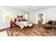 Main bedroom with hardwood floors and access to ensuite bathroom at 11730 Ansley Ct, Zionsville, IN 46077