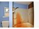 Small bathroom with shower/tub combo and worn-out walls at 214 Tippecanoe Dr, Noblesville, IN 46062