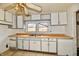 dated kitchen with worn countertops and cabinets at 214 Tippecanoe Dr, Noblesville, IN 46062