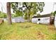 Spacious backyard with two sheds and mature trees at 214 Tippecanoe Dr, Noblesville, IN 46062