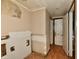 Hallway with damaged walls and flooring at 214 Tippecanoe Dr, Noblesville, IN 46062