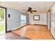 Living room with laminate wood flooring and ceiling fan at 214 Tippecanoe Dr, Noblesville, IN 46062
