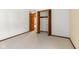 Spacious bedroom with wood closet doors at 11741 W Grandview Dr, Columbus, IN 47201