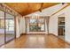 Bright dining room with hardwood floors, chandelier, and sliding glass doors at 11741 W Grandview Dr, Columbus, IN 47201