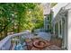 Large deck with table and chairs overlooking the backyard at 6438 Pin Oak Dr, McCordsville, IN 46055