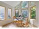 Cozy breakfast nook with a glass table and wicker chairs near large windows at 6438 Pin Oak Dr, McCordsville, IN 46055