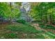 Two-story house surrounded by green landscaping, path to patio at 6438 Pin Oak Dr, McCordsville, IN 46055