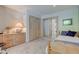 Cozy bedroom with a twin bed, built in wooden dresser and closet at 6438 Pin Oak Dr, McCordsville, IN 46055