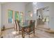 Elegant dining room featuring a glass table and modern chairs at 6438 Pin Oak Dr, McCordsville, IN 46055