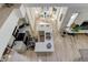 Modern kitchen with L-shaped island and white cabinets at 6438 Pin Oak Dr, McCordsville, IN 46055