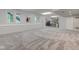 Spacious finished basement with gray carpeting, wet bar, and plenty of natural light at 6438 Pin Oak Dr, McCordsville, IN 46055
