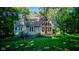 A-frame house with large windows and green lawn at 6438 Pin Oak Dr, McCordsville, IN 46055