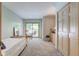 Bright bedroom with sliding door to deck, a full-size bed, and built-in dresser at 6438 Pin Oak Dr, McCordsville, IN 46055