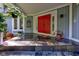 Red front door with stone flooring at 6438 Pin Oak Dr, McCordsville, IN 46055