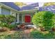 Red front door and landscaping at 6438 Pin Oak Dr, McCordsville, IN 46055