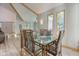 Sunlit dining area with hardwood floors and large windows at 6438 Pin Oak Dr, McCordsville, IN 46055