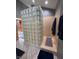 Walk-in shower with glass block wall and neutral colors at 6438 Pin Oak Dr, McCordsville, IN 46055