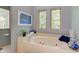 Bathroom with large jetted tub and two windows at 6438 Pin Oak Dr, McCordsville, IN 46055