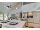 Open concept kitchen with island, stainless steel appliances, and vaulted ceiling at 6438 Pin Oak Dr, McCordsville, IN 46055