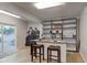 Finished basement featuring a wet bar and sliding glass door to patio at 6438 Pin Oak Dr, McCordsville, IN 46055