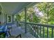 Deck with table and chairs, offering scenic wooded views at 6438 Pin Oak Dr, McCordsville, IN 46055