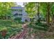 Two-story house nestled in lush woods with deck and patio at 6438 Pin Oak Dr, McCordsville, IN 46055