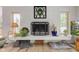 Modern fireplace with white tile surround and decorative mantel at 6438 Pin Oak Dr, McCordsville, IN 46055