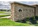 Fox Creek community entrance sign with stonework and landscaping at 5628 Cattail Branch Ln, Clayton, IN 46118