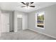 Bright bedroom with neutral walls, carpet flooring, and a large window at 7234 N Christopher Ln, Fairland, IN 46126
