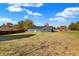 Rear view of house showcasing gray siding and a spacious backyard at 7234 N Christopher Ln, Fairland, IN 46126
