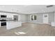 Modern kitchen with white cabinets, stainless steel appliances, and granite countertops at 7234 N Christopher Ln, Fairland, IN 46126