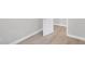Clean and bright hallway featuring neutral walls and wood-look flooring at 7234 N Christopher Ln, Fairland, IN 46126