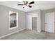 Well-lit bedroom, featuring a ceiling fan and closet at 7234 N Christopher Ln, Fairland, IN 46126