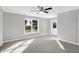 Spacious bedroom with carpet flooring and access to the backyard at 7234 N Christopher Ln, Fairland, IN 46126