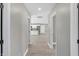 Bright hallway with light grey walls and hardwood floors at 7234 N Christopher Ln, Fairland, IN 46126