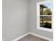 Bright office space with a view, neutral gray walls, and wood-look flooring at 7234 N Christopher Ln, Fairland, IN 46126
