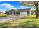 Ranch home with stone accents and a two-car garage at 7234 N Christopher Ln, Fairland, IN 46126