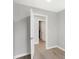 Light and bright hallway with wood-look flooring and neutral walls at 7234 N Christopher Ln, Fairland, IN 46126