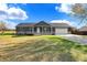 Modern ranch home with stone accents and a two-car garage at 7234 N Christopher Ln, Fairland, IN 46126