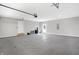 Large garage featuring an automatic door opener and epoxy flooring at 7234 N Christopher Ln, Fairland, IN 46126