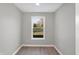 Bright home office with neutral gray walls and wood-look flooring at 7234 N Christopher Ln, Fairland, IN 46126