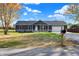 Ranch home with stone accents, two-car garage, and mailbox at 7234 N Christopher Ln, Fairland, IN 46126