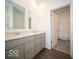 Modern bathroom featuring a double vanity and gray cabinetry at 5628 Cattail Branch Ln, Clayton, IN 46118