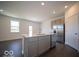 Kitchen with an island, stainless steel appliances, and white countertops at 5628 Cattail Branch Ln, Clayton, IN 46118