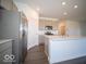 Modern kitchen with white countertops, stainless steel appliances, and ample storage at 5628 Cattail Branch Ln, Clayton, IN 46118