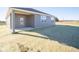 Gray house with covered patio and small backyard at 7920 Magnolia St, New Palestine, IN 46163